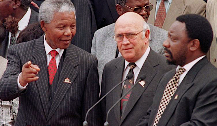 Mandela, FW de Klerk and Ramaphosa outside Parliament on the day the new constitution was adopted, 8 May 1996